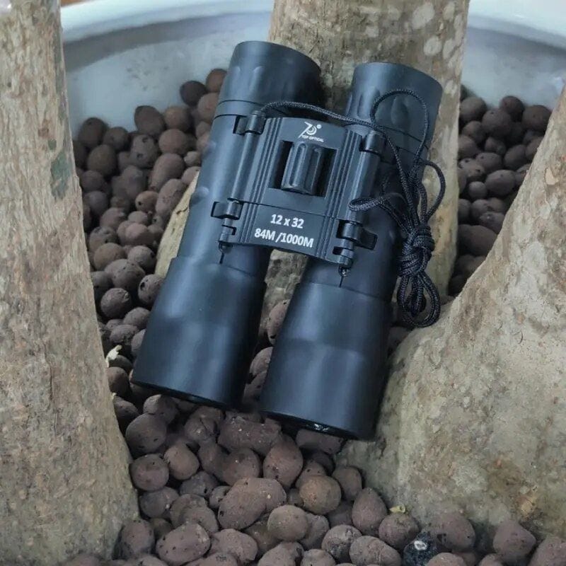 High-quality 12x32 outdoor binoculars for travel and sports viewing. Features 84M/1000M, compact design, suitable for adventures and birdwatching. Perfect for optical enthusiasts and outdoor explorers.