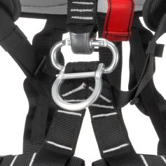Durable black harness with sturdy metal D-ring, adjustable straps, and secure fastenings, ideal for climbing, rescue, and industrial safety applications.
