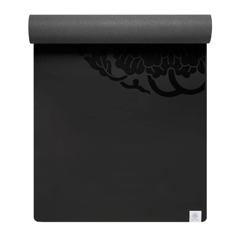 Black yoga mat with eco-friendly design, non-slip surface, ideal for home workouts and meditation. Lightweight and durable, perfect for all fitness levels and yoga practices.