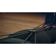 Close-up of bicycle wheel with black tire and spokes in a modern loop design, showcasing high-quality replacement bike parts from Monalisa Store for optimal cycling performance.