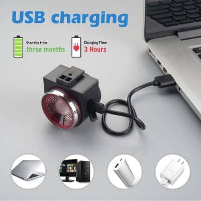 Alt text: Close-up of a USB charging device connected to a laptop, showcasing fast charging capabilities with a sleek black design and compatible with various electronic gadgets.