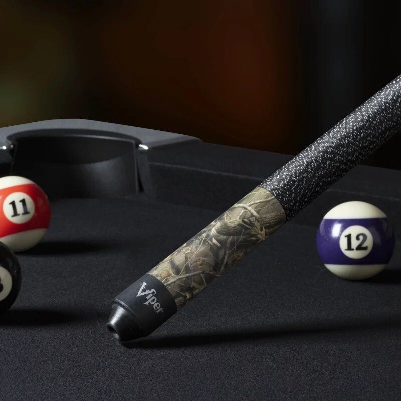 High-quality billiards cue stick with camouflage design, set on a black billiards table with numbered balls, perfect for professional or recreational pool games at Monalisa Store.