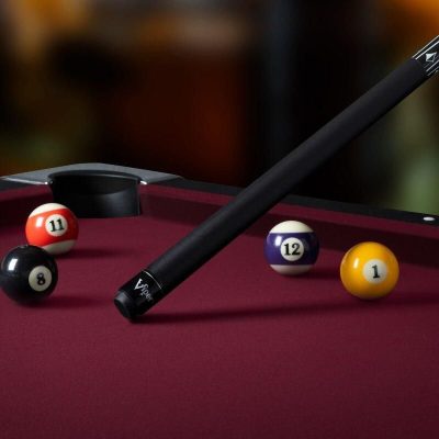 Pool cue with billiard balls on a red table for optimal gameplay.