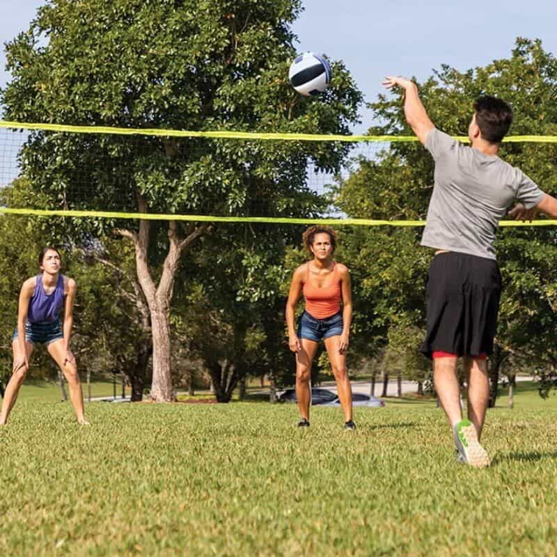 Volleyball game at the park with friends, outdoors, active lifestyle, team sport, enjoying summer, sporting activity, recreational sport, social activity, athletic outdoor fun.