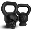 Black skull-shaped kettlebell for strength training and fitness, 35 lbs (16 kg) with durable cast iron construction and ergonomic handle design. Perfect for intense workouts and muscle building.