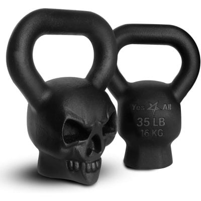 Black skull-shaped kettlebell for strength training and fitness, 35 lbs (16 kg) with durable cast iron construction and ergonomic handle design. Perfect for intense workouts and muscle building.