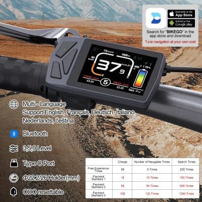Modern digital bike display showing speed, trip, and battery info on rugged mountain trail setting.