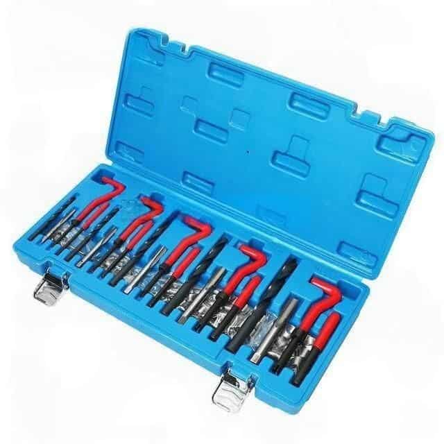 High-quality dental tools with red and black handles, organized in a compact blue storage box for professional dental care.