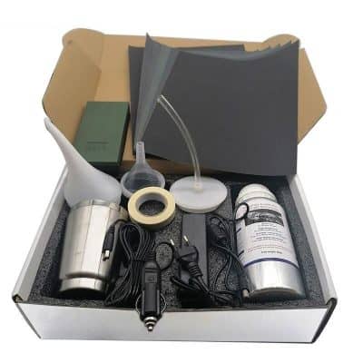 A comprehensive eye care kit featuring diagnostic tools, lighting, solutions, and accessories for eye examinations and optical practice setup.