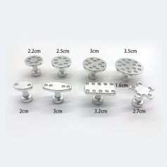 Miniature medical tools for surgical procedures or medical training, including various sizes and shapes of metal instruments for precise medical applications.