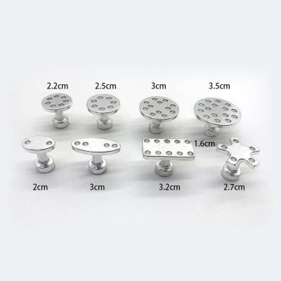 Miniature medical tools for surgical procedures or medical training, including various sizes and shapes of metal instruments for precise medical applications.