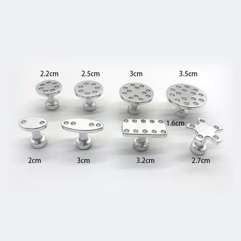 Miniature medical tools for surgical procedures or medical training, including various sizes and shapes of metal instruments for precise medical applications.