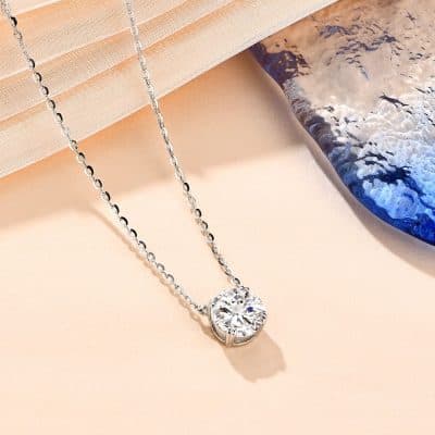 Stunning silver necklace with a sparkling round-cut diamond pendant, perfect for special occasions and everyday luxury jewelry collection.