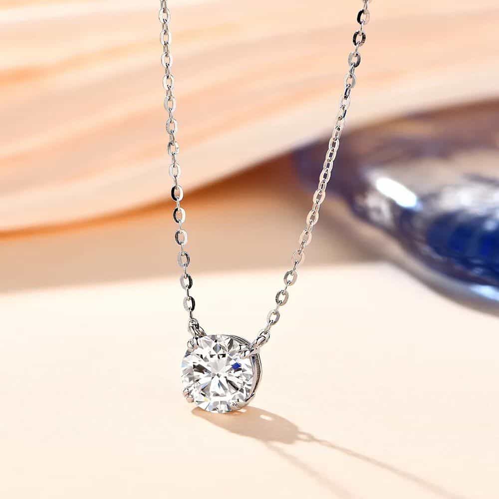 A stunning silver chain necklace featuring a sparkling round-cut diamond pendant, perfect for special occasions and enhancing your elegant style.