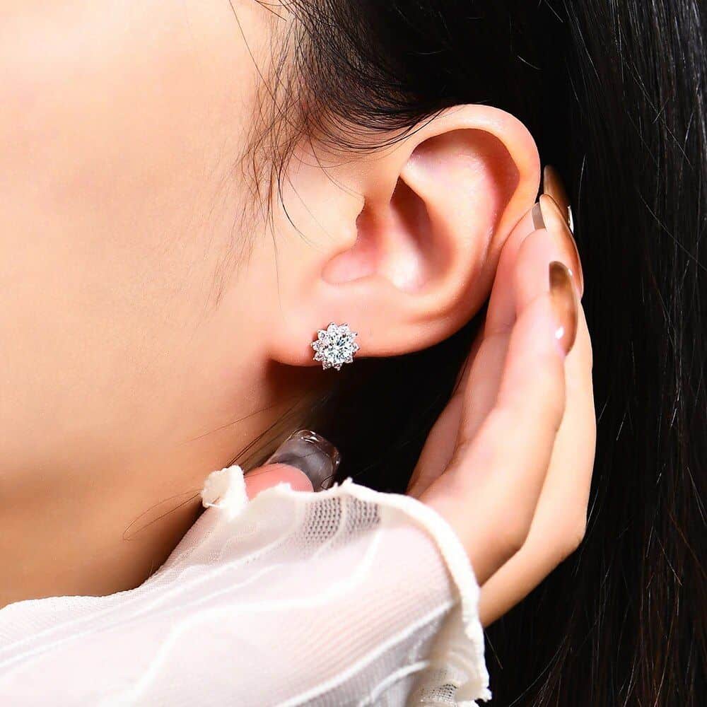 Stunning close-up of a woman's ear adorned with a sparkling diamond flower stud earring, highlighting luxury jewelry options at Monalisa Store for elegant accessories.