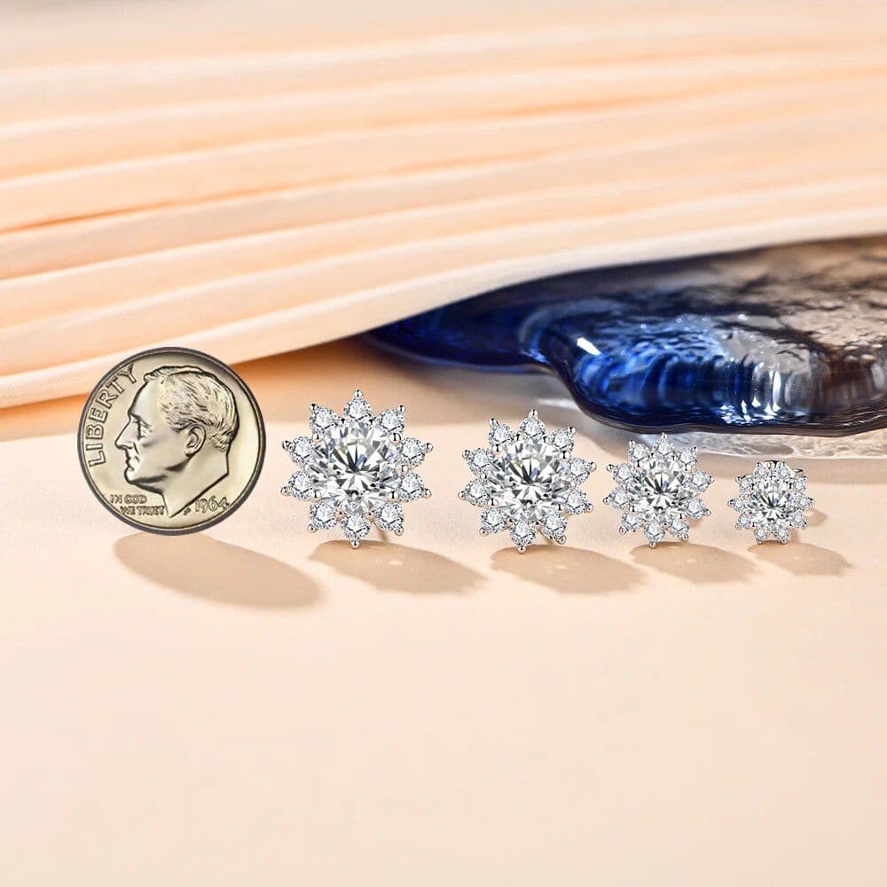 Stunning diamond snowflake-shaped earrings displayed with vintage coin for size comparison, perfect for jewelry lovers seeking luxurious and sparkling accessories at Monalisa Medical Store.