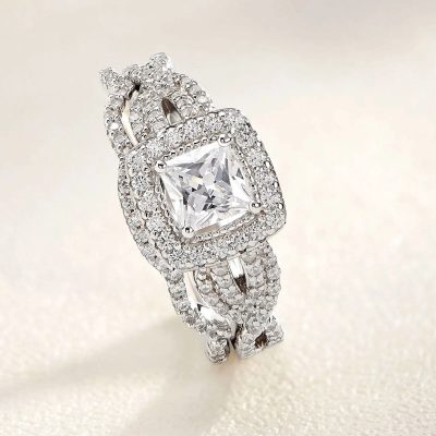 Stunning luxury diamond ring with intricate pavé setting, featuring a large princess-cut center stone and dazzling surrounding pavé diamonds for a sophisticated look. Perfect for special occasions or engagement.