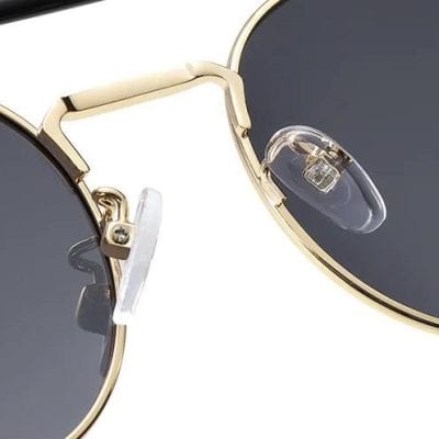 Luxury gold framed sunglasses with tinted lenses for style and UV protection. Perfect for fashion-forward individuals seeking high-quality eyewear from Monalisa Store.