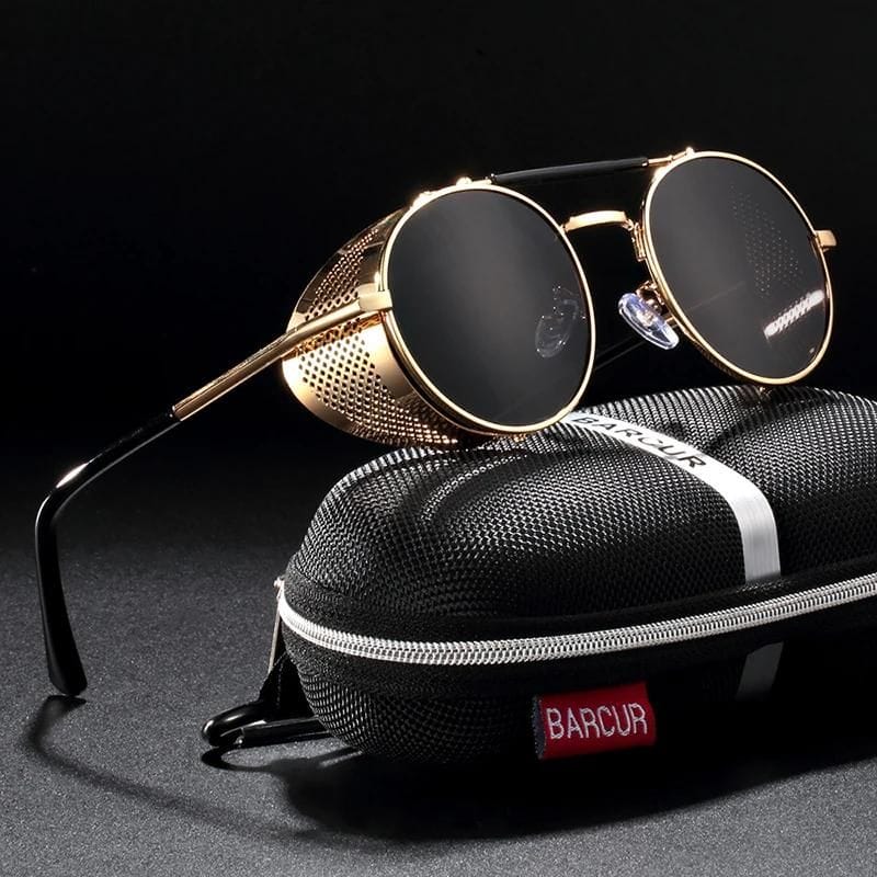 Stylish black sunglasses with gold frame, perfect for fashion and eye protection, ideal for opticians and eyewear lovers.