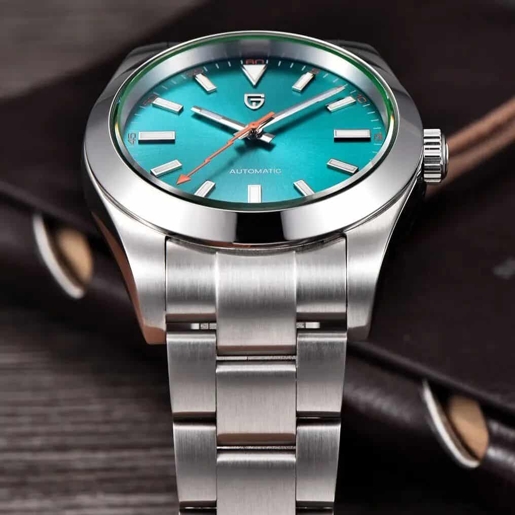 Elegant men's wristwatch featuring a vibrant blue dial, stainless steel band, and automatic movement. Ideal for fashion-conscious individuals seeking quality timepieces. Available now at Monalisa Store.