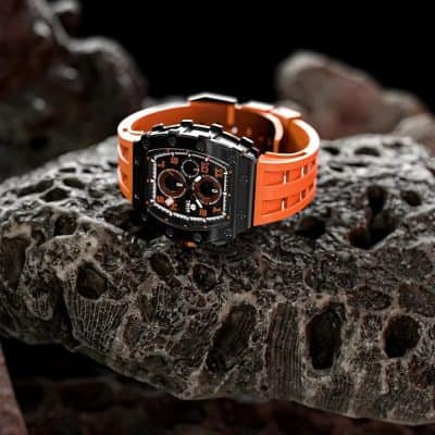 High-end men's fashion watch featuring black dial, orange strap, chronograph functions, and durable construction for stylish, everyday wear.
