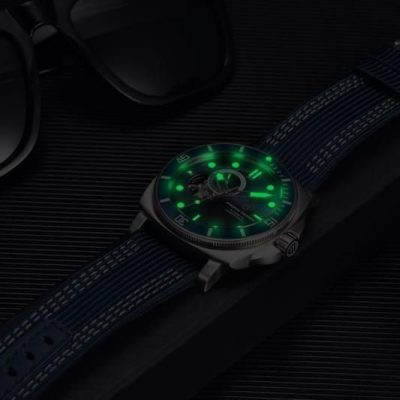 Elegant men's watch featuring a glowing green luminescent dial and durable strap, perfect for stylish accessories and timekeeping.