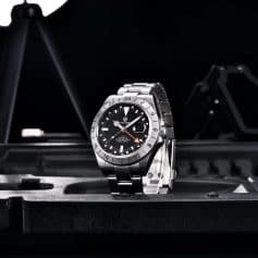 Elegant stainless steel men's watch showcasing GMT and automatic features, water-resistant up to 200m, ideal for sports and fashion enthusiasts.