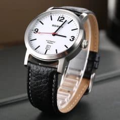 Elegant men’s wristwatch with black leather strap and white dial showing date and automatic movement. Perfect for formal and casual occasions, available at Monalisa Store.