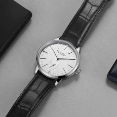 High-quality men's wristwatch featuring a sleek white dial, automatic movement, and black leather strap. Perfect for dressing up your look and making a statement of elegance.