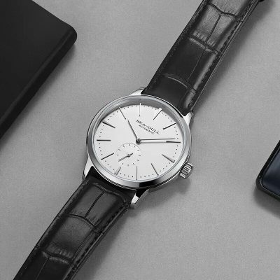 High-quality men's wristwatch featuring a sleek white dial, automatic movement, and black leather strap. Perfect for dressing up your look and making a statement of elegance.