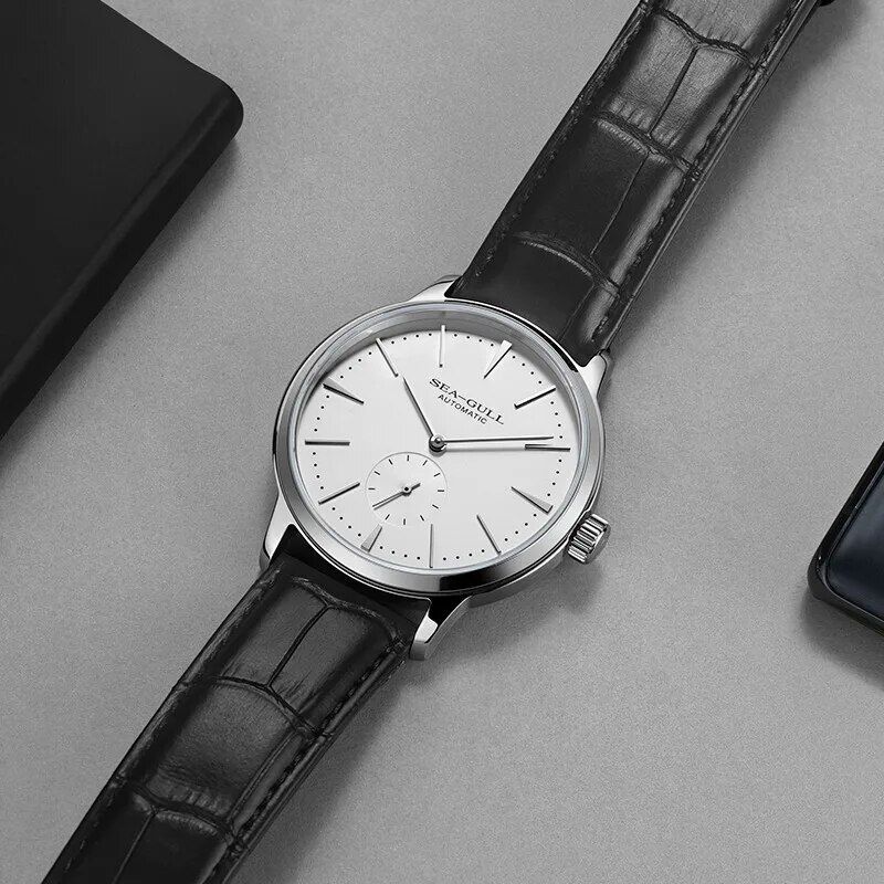 High-quality men's wristwatch featuring a sleek white dial, automatic movement, and black leather strap. Perfect for dressing up your look and making a statement of elegance.