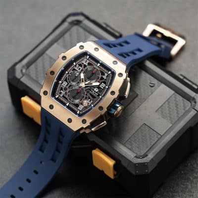 High-end luxury watch with a detailed chronograph dial, embedded in a sleek rose gold case and fitted with a blue rubber strap. Perfect for style-conscious individuals and watch enthusiasts.