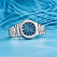 Detailed description: A premium stainless steel men's watch featuring a striking blue dial with sleek hour markers and a modern design, perfect for fashion and optical accessories.