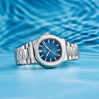 Detailed description: A premium stainless steel men's watch featuring a striking blue dial with sleek hour markers and a modern design, perfect for fashion and optical accessories.