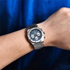 Elegant men's stainless steel watch with chronograph features, silver accents, and date display, perfect for fashion-forward individuals and watch enthusiasts.