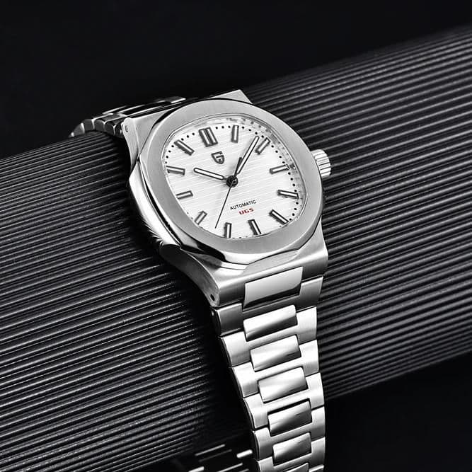 Elegant stainless steel automatic wristwatch with white dial and modern design.