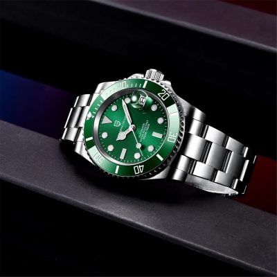 Elegant green dial wristwatch showcasing classic design with date magnifier and water resistance.