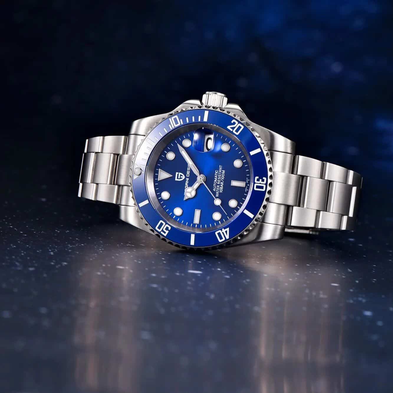 High-quality stainless steel watch with blue bezel and dial, features date magnifier, water-resistant, ideal for diving and everyday wear.