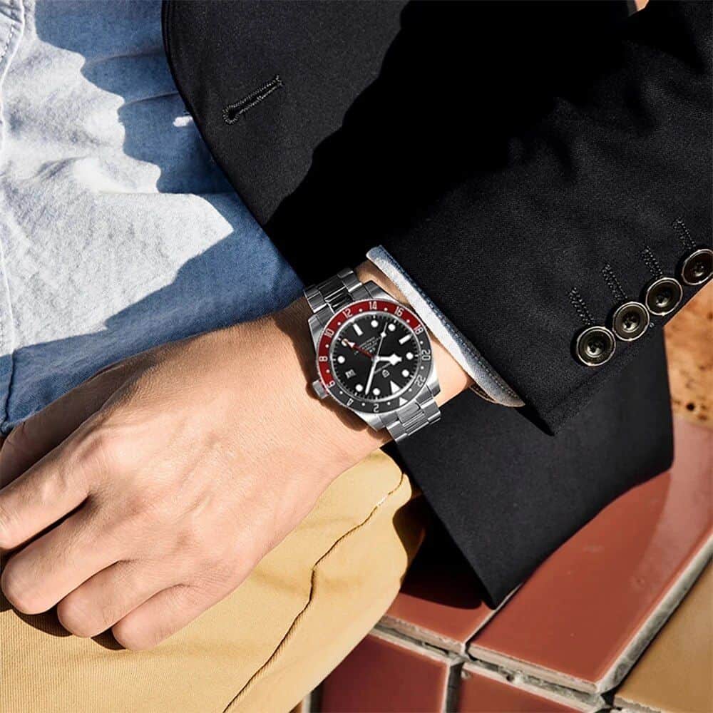 Men's luxury wristwatch featuring stainless steel band, black dial, and red accents, perfect for stylish occasions and everyday wear.