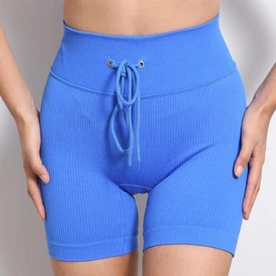 High-waisted blue athletic shorts with drawstring, perfect for workout and leisure. Designed for comfort and style, these ribbed shorts are ideal for women seeking versatile activewear.