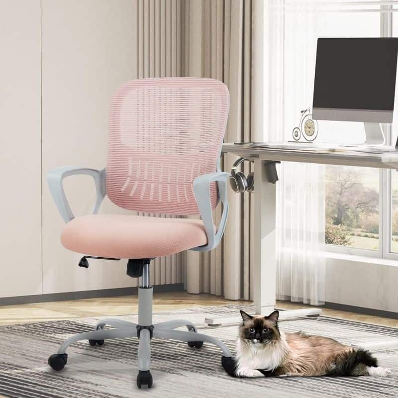Comfortable pink office chair with ergonomic design in home office setting, featuring adjustable height, breathable mesh back, and casters for mobility, ideal for work-from-home scenarios.