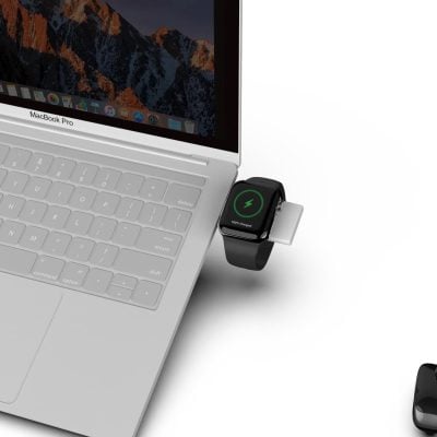Wireless charging Apple Watch connected to MacBook Pro with MagSafe charger, highlighting seamless tech accessories for Apple devices.