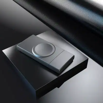 Wireless phone charging device with sleek silver design, compatible with various smartphones, placed on a modern surface in a sophisticated setting.