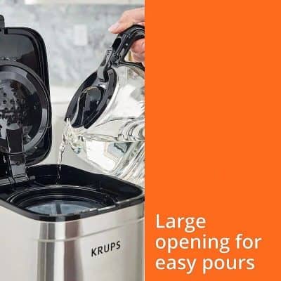 Effortlessly pour water into the large opening of the coffee maker, making brewing quick and convenient. Perfect for busy mornings, this stylish and functional device enhances your coffee experience.