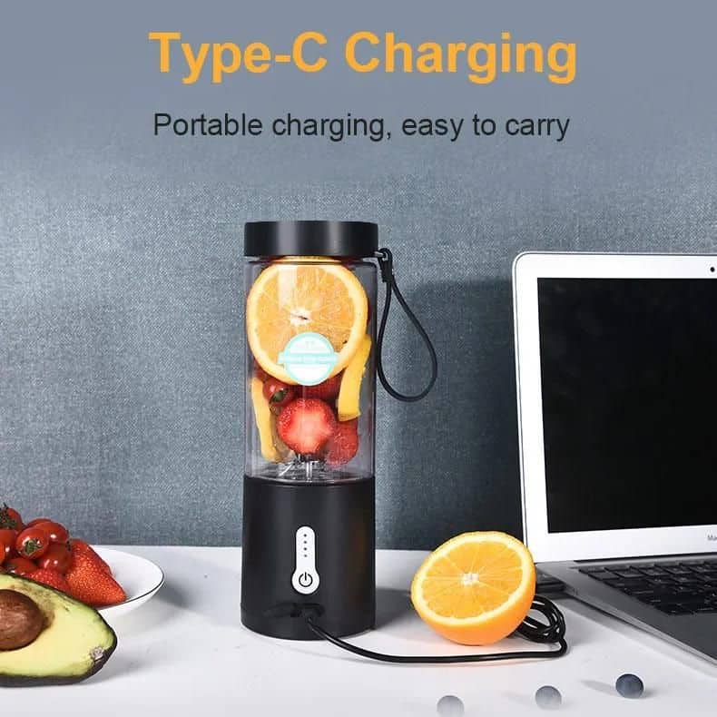 A portable blender blending fresh fruits like strawberries, bananas, and oranges, ideal for healthy smoothies on the go. Perfect for travel, outdoor activities, or quick nutrition at home or work.