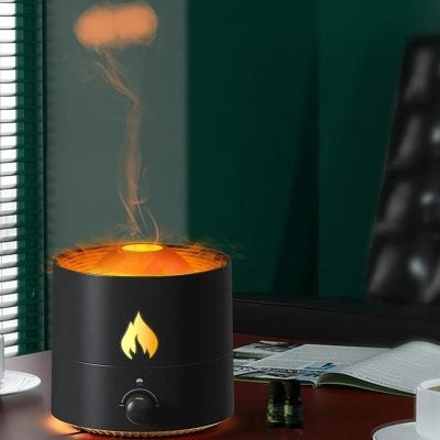 Aromatherapy diffuser in black with mist and warm glow, perfect for creating a calming environment, available at Monalisa Store, your premier optometry center for quality eye care products.