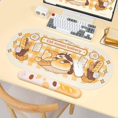 Cute cat bakery-themed desk mat with bread and pastry illustrations, perfect for adding charm and comfort to your workspace with this adorable design.