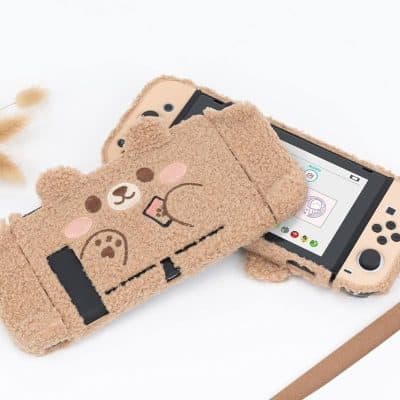 Deluxe beige teddy bear-themed digital device protector for Nintendo Switch or gaming consoles, featuring a plush, cuddly design and cartoon bear face, ideal for kids and gaming enthusiasts.