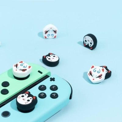 Cute Japanese-inspired kitty and mask-themed game controller charms for Nintendo Switch accessories. Perfect for anime, gaming, and kawaii collectors.