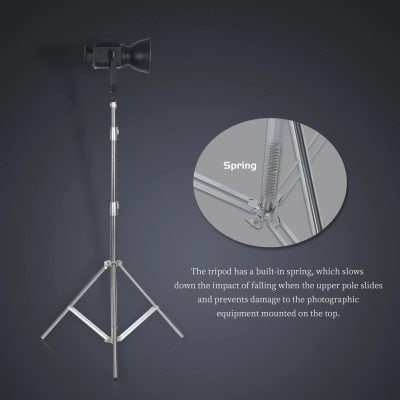 Adjustable tripod with built-in spring, designed to absorb impact and protect photographic equipment during setups. Ideal for professional and studio use, ensuring stability and safety for cameras and lighting gear.